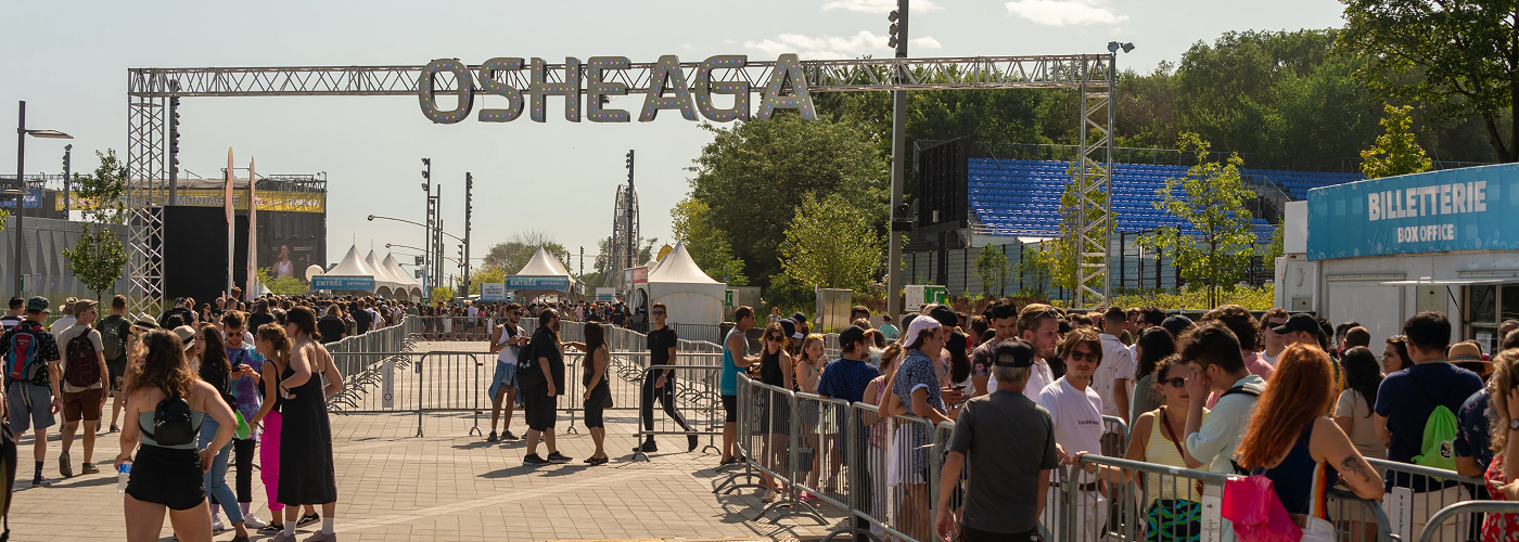 Festival entrance gate with large crowd